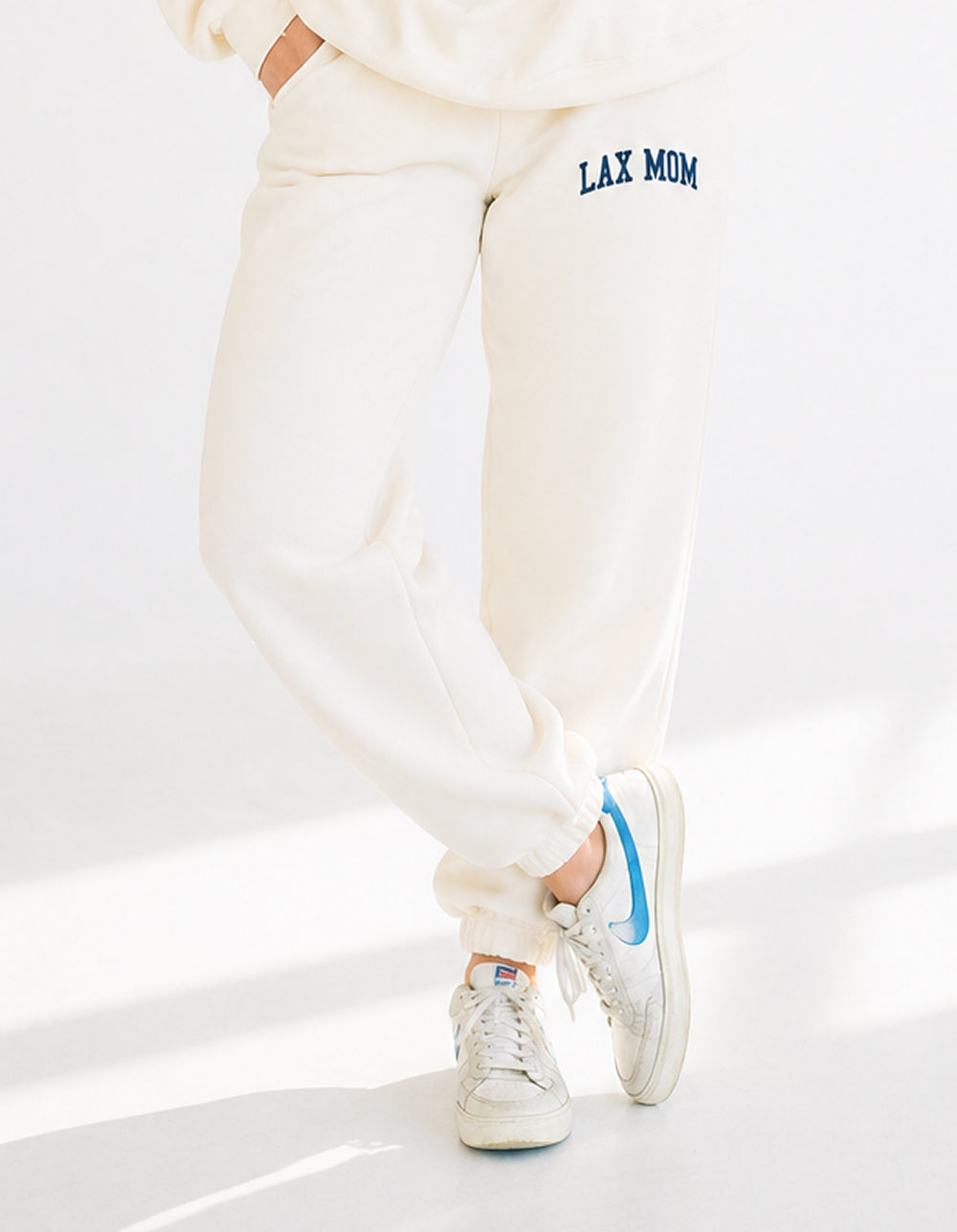 Lax Mom bone sweatpants on model