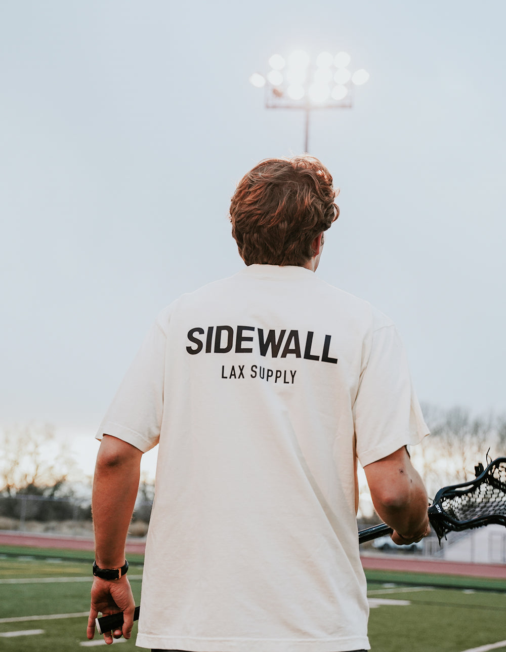 Sidewall Core white lacrosse tee lifestyle photo