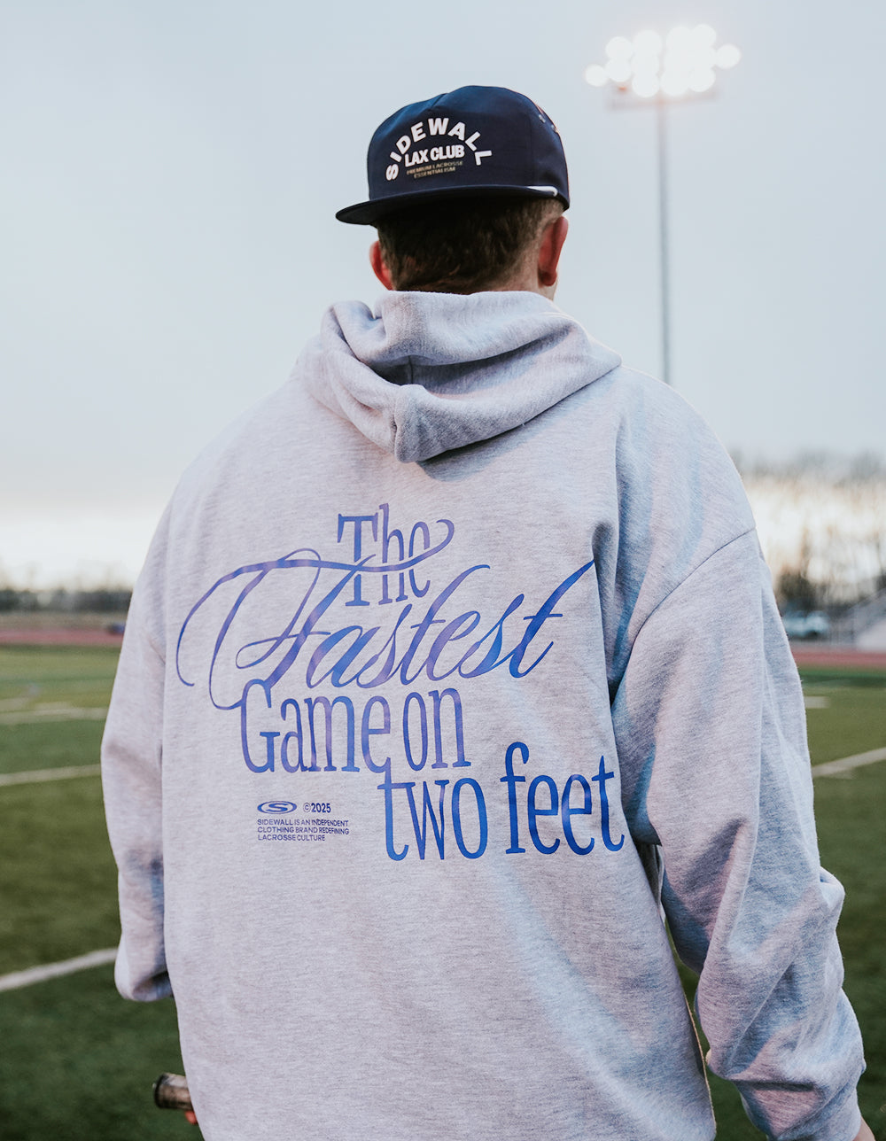 Fastest Game heather gray lacrosse hoodie back graphic lifestyle