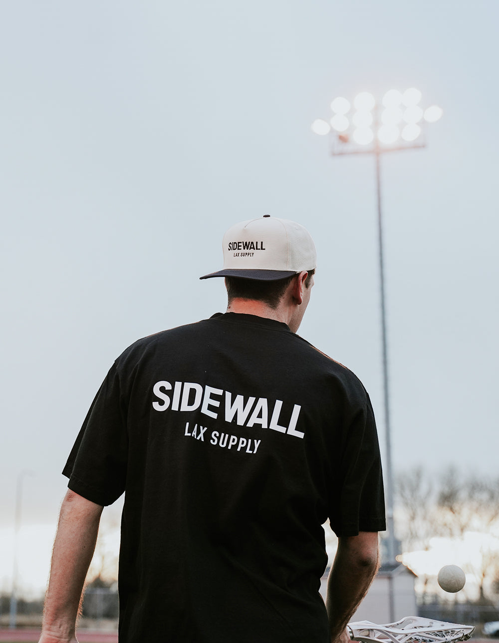 Sidewall Core black lacrosse tee lifestyle photo