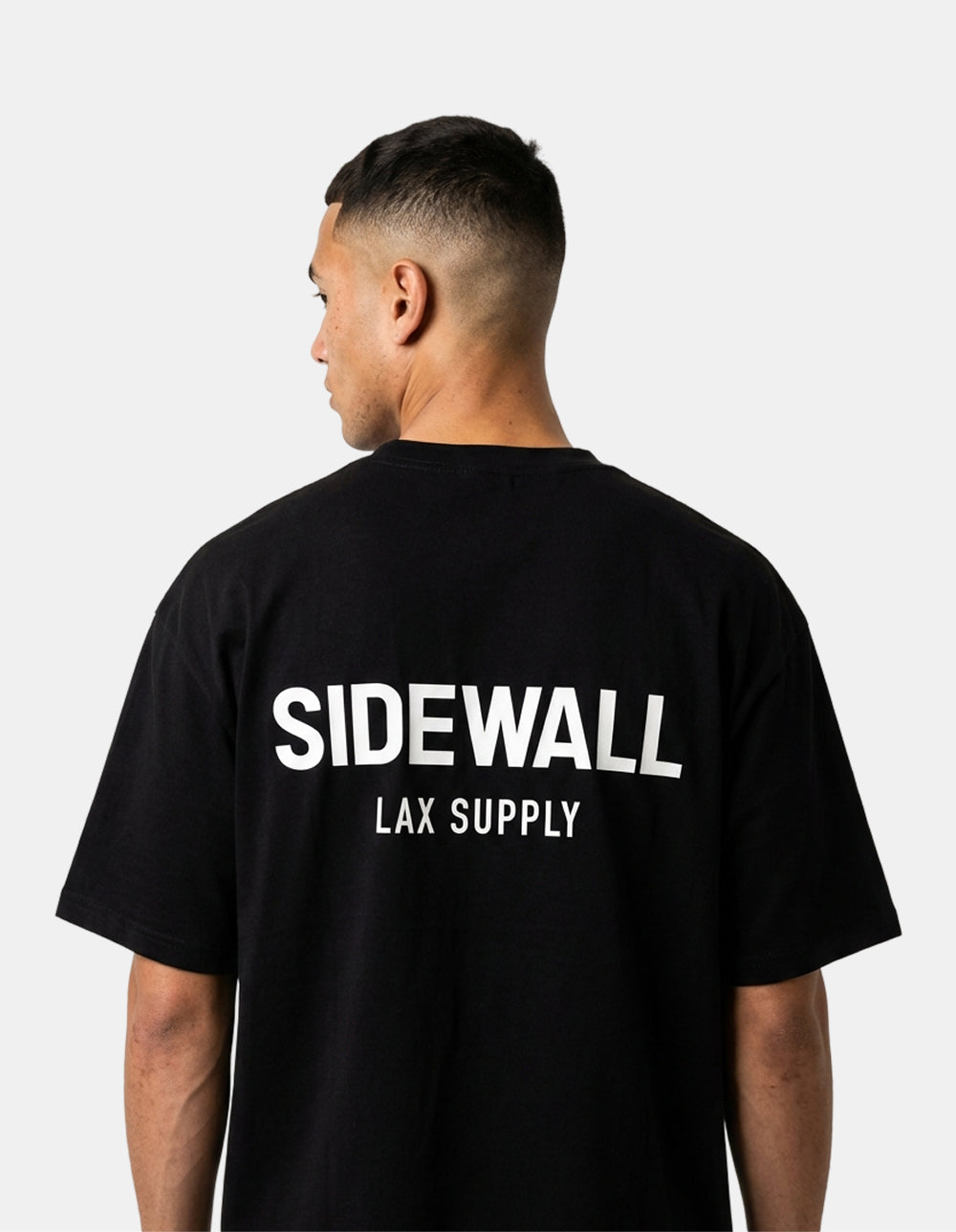 Sidewall Core black oversized lacrosse tee back on model