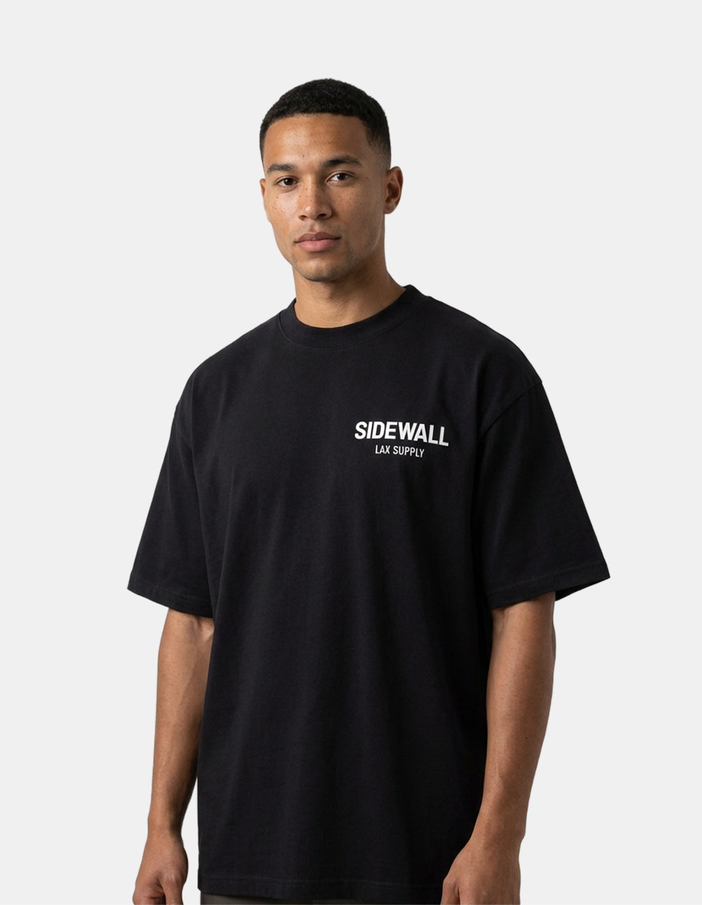 Sidewall Core black oversized lacrosse tee front on model