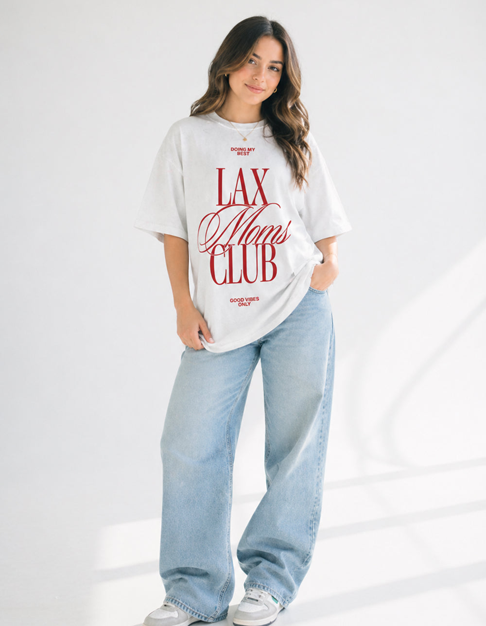 Lax Mom Club white oversized tee on model